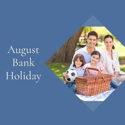A smiling family poses in a park on a sunny day with a picnic hamper, part of a campaign celebrating August Bank Holiday. The casual, joyful atmosphere makes this suitable for family vacation promotions, outdoor leisure activities, or seasonal marketing materials emphasizing relaxation and quality time together.