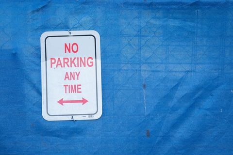 No parking sign on blue fabric background