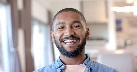 Smiling Man at Home Radiating Positivity and Warmth