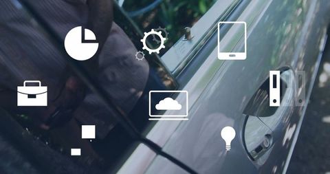 Executive using smart devices near vehicle illustrating mobility concept