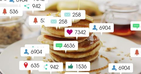 Pancake stack drizzling syrup over banana with floating social media notification icons