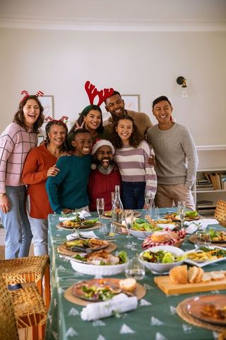 Joyful Family Celebrating Holidays Around Festive Dinner Table