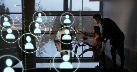Diverse Team Collaborating on Digital Data Projection in Modern Office