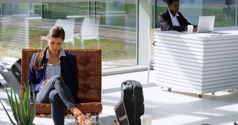 Business Professionals in Modern Lobby with Technology Devices - Download Free Stock Images Pikwizard.com