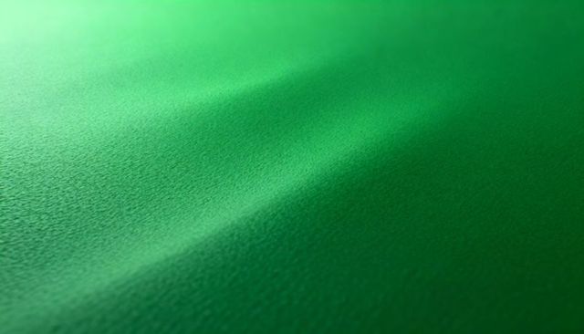 Displaying green velvet fabric nap with diagonal ridge, soft gradient shadow, macro