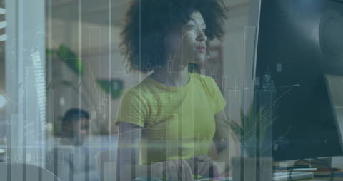 Businesswoman Engaged with Data Visualization on Computer Screen