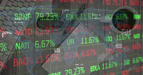 World Map with Digital Stock Market Data Overlapping Office Desk