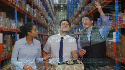 Diverse Team Analyzing Digital Data in Modern Warehouse