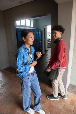 Diverse Students Engaging in Friendly Conversation at School