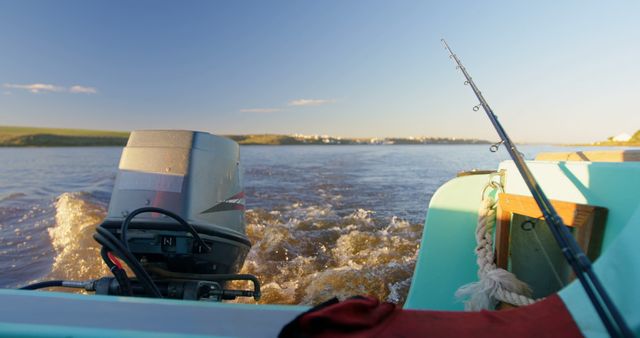 A motorboat speeds across the water, fishing rod ready for action - Download Free Stock Photos Pikwizard.com