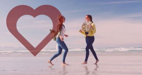 Women Enjoying Playful Beach Day, Engaging in Outdoor Fun and Friendship