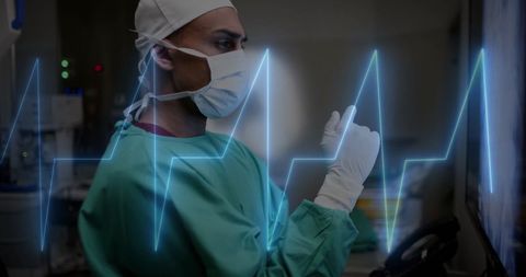 Surgeon analyzing digital pulsing data in hospital
