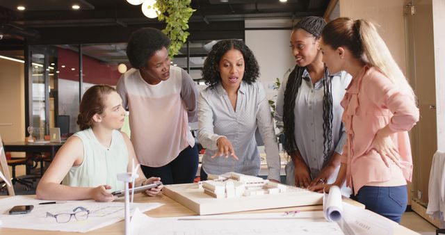 Diverse Female Team Collaborating on Architectural Project - Download Free Stock Images Pikwizard.com