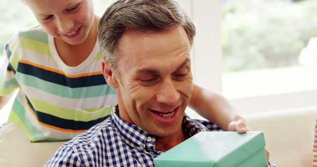 Father Receiving Gift from Son on Special Occasion - Download Free Stock Images Pikwizard.com