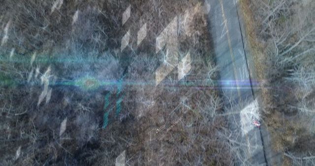 Boy Cycling Rural Road with Digital Overlay Reflecting Technology and Adventure