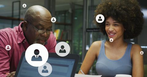 Diverse Colleagues Engaging in Creative Office Discussion