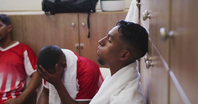 Dejected Soccer Players Sitting in Locker Room After Match Defeat - Download Free Stock Images Pikwizard.com