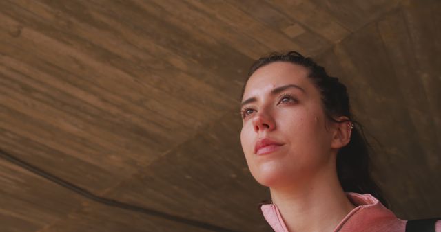 Confident Woman Looking Forward under Concrete Ceiling - Download Free Stock Images Pikwizard.com