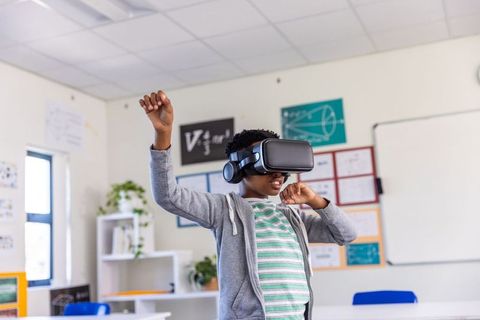 African american student experiencing virtual reality in classroom for interactive stem learning