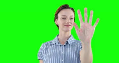 Woman Using Virtual Screen with Hand on Green Screen Background