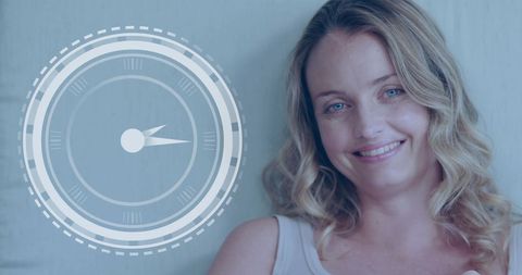 Smiling Caucasian Woman Next to Digital Clock Display