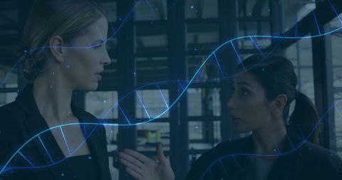 Businesswomen discussing biotech with dna helix overlay