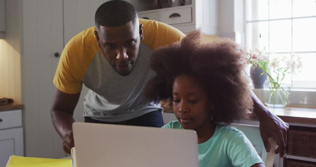 Father Helping Daughter with Online Learning in Kitchen - Download Free Stock Images Pikwizard.com