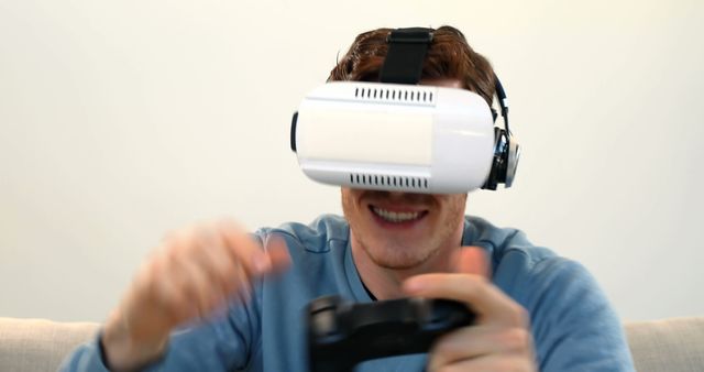 Young Man Using Virtual Reality Headset While Gaming at Home - Download Free Stock Images Pikwizard.com