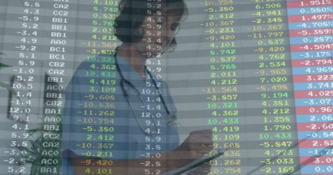 Nurse Analyzing Medical Data in a Technological Environment