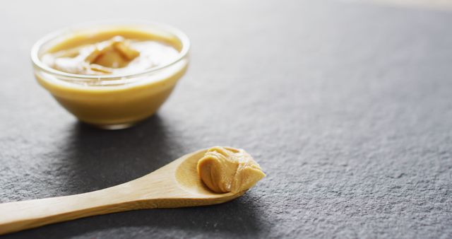 Smooth Peanut Butter on Wooden Spoon with Bowl - Download Free Stock Images Pikwizard.com