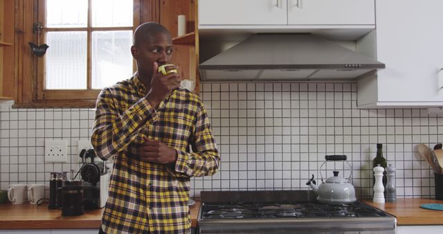 Man Drinking Coffee in Cozy Kitchen Area - Download Free Stock Images Pikwizard.com