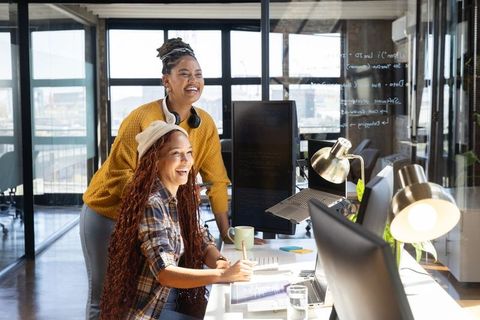 Diverse Women Collaborating in Modern Bright Office Environment
