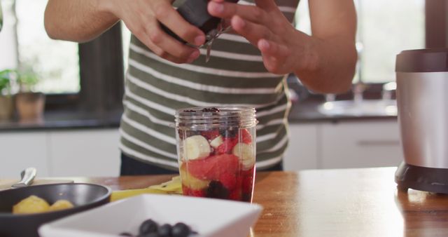 Man Preparing Healthy Smoothie with Fresh Fruits in Kitchen - Download Free Stock Images Pikwizard.com