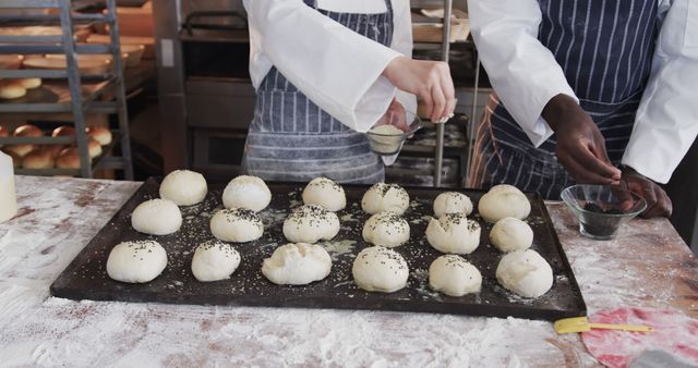 Bakers Preparing Dough Balls with Seeds in Industrial Kitchen - Download Free Stock Images Pikwizard.com