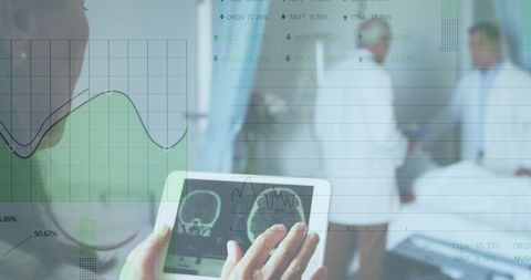 Doctor Reviews Brain Scans on Tablet in Modern Healthcare Setting