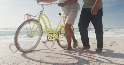 Senior Couple Relaxation at Beach with Vintage Bicycle