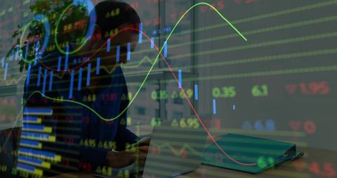 Investor checking smartphone while analyzing laptop with live stock market charts overlay