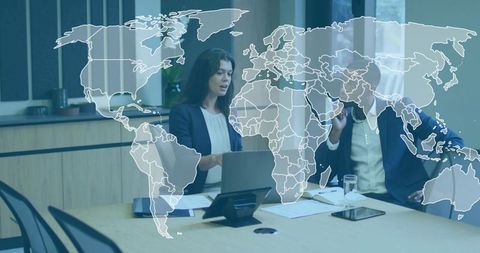 Business leaders discussing global strategy in boardroom with world map overlay