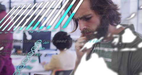 Bearded developer analyzing mobile data with digital dashboard overlays in coworking office