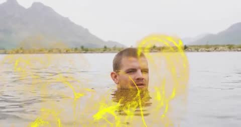 Man Creating Yellow Energy in Mountain Lake Demo