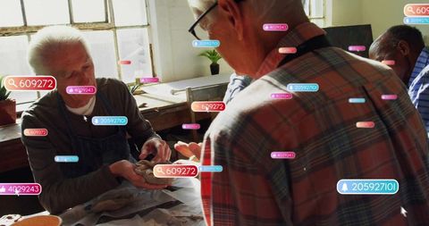 Artisans shaping clay with digital integration in ceramics studio