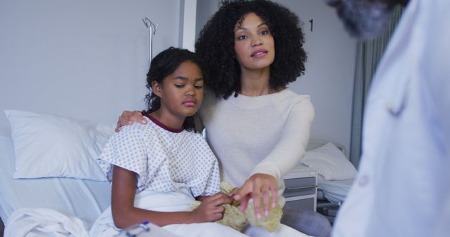 Mother Comforting Daughter in Hospital Bed During Doctor Visit - Download Free Stock Images Pikwizard.com