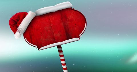 Blank Christmas Signpost with Santa Hat on Magic Holiday Background