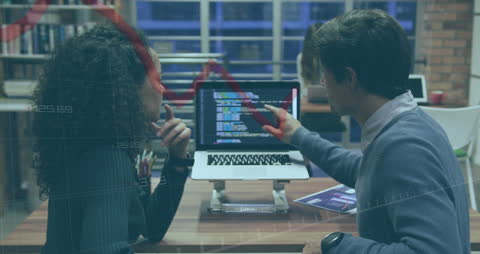 Business Experts Analyzing Computer Data in Office