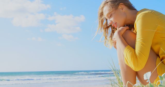 Relaxed Woman in Yellow Dress Enjoying Sunny Beach Landscape - Download Free Stock Images Pikwizard.com