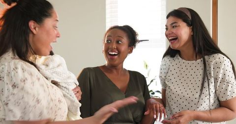 Friends Celebrating Special Announcement With Joyful Expressions