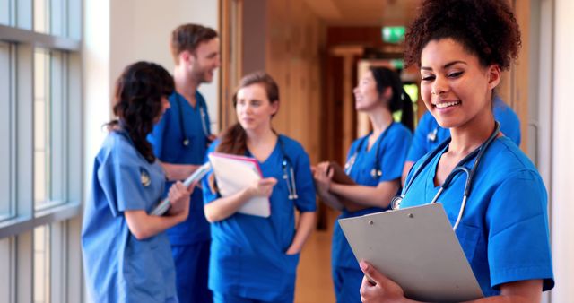 Group of Medical Students Standing in Hospital Hallway Conversing and Studying - Download Free Stock Images Pikwizard.com