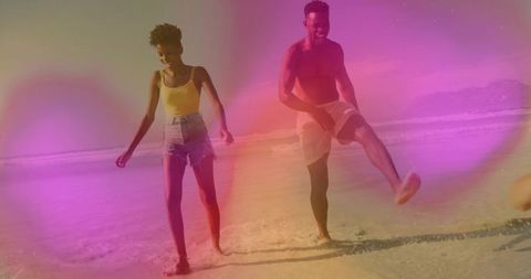 Sunny Beach Splashing Couple Embracing Joyful Moments