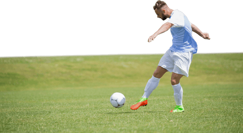 Transparent Male Soccer Player Kicking Football on Green Field - Download Free Stock Videos Pikwizard.com