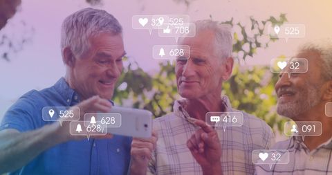 Senior men engaging with social media on smartphone